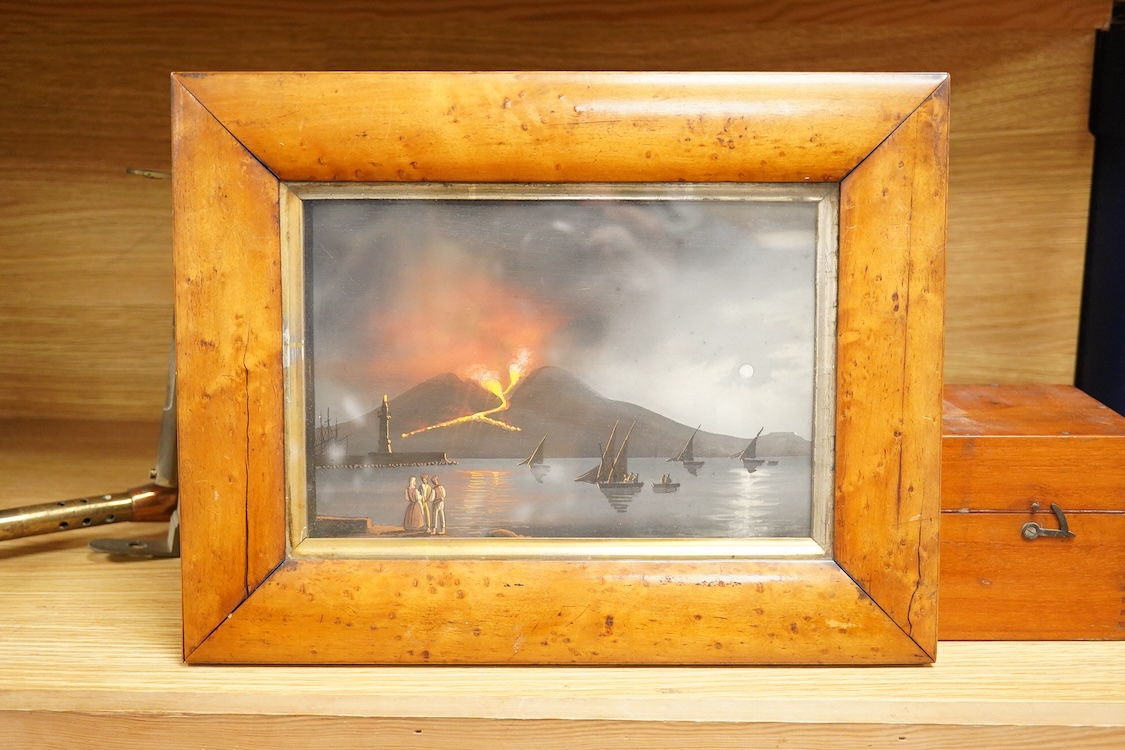 Neapolitan School, Mount Vesuvius erupting and a coastal promenade, pair of naive gouaches, maple framed, 15 x 22cm